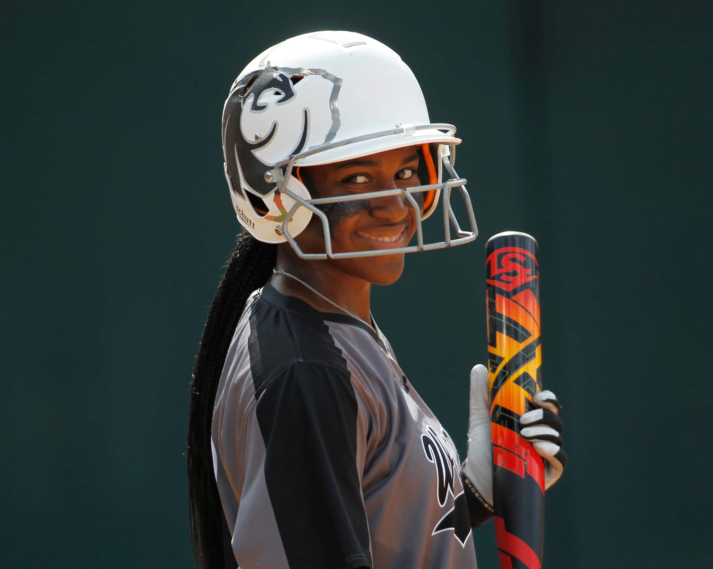 Denton Guyer outfielder Briana Williams (13) sports a smile toward the team dugout before...