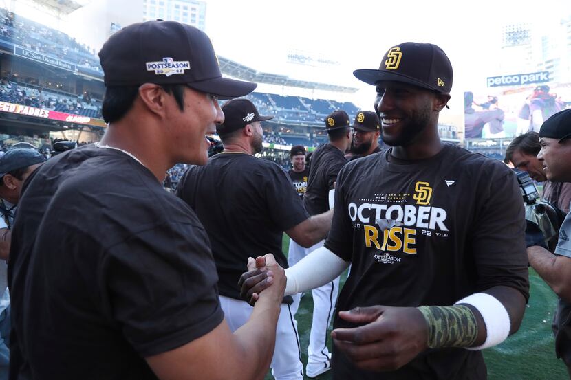 San Diego Padres' Jurickson Profar, right, celebrates with Ha-Seong Kim following a baseball...