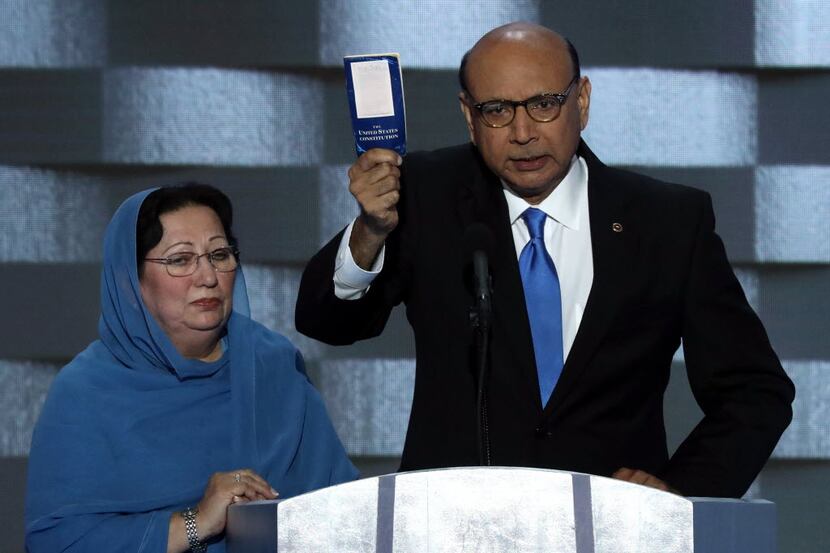 Khizr Khan, father of Army Capt. Humayun S. M. Khan, who died in fighting in Iraq, holds up...