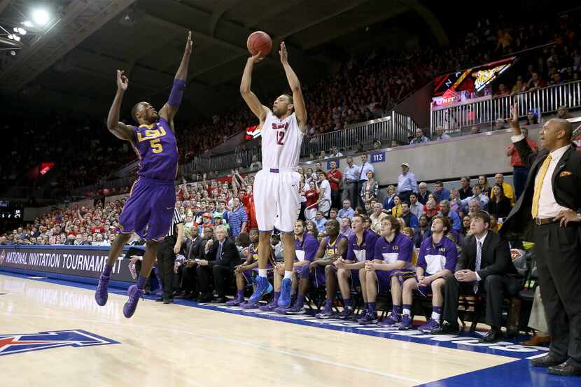 SMU Mustangs guard Nick Russell (12) shoots a three-pointer past LSU Tigers forward Shavon...