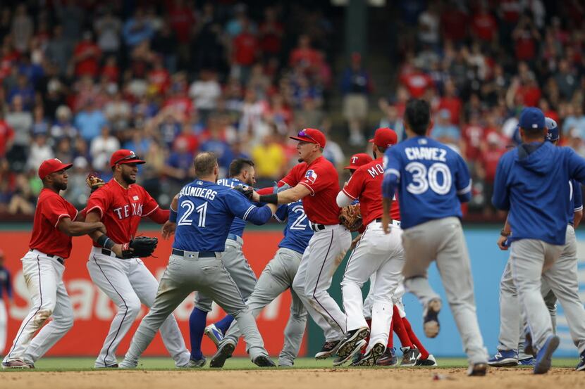 ARLINGTON, TX - MAY 15:  The Toronto Blue Jays and the Texas Rangers clear the bench after...