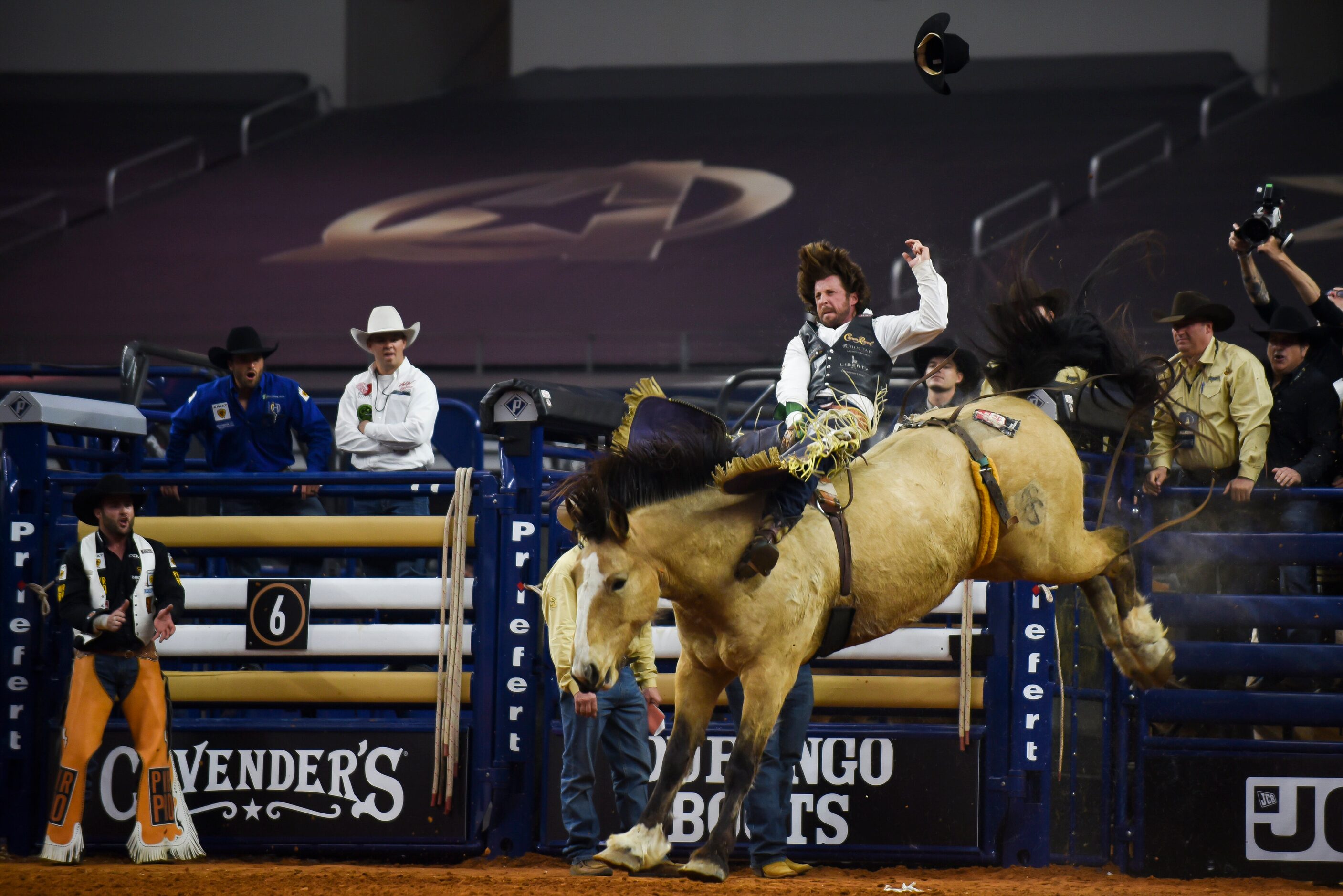 Tilden Hopper attempts to stay on his horse as a part of the Bareback Bronc event during the...