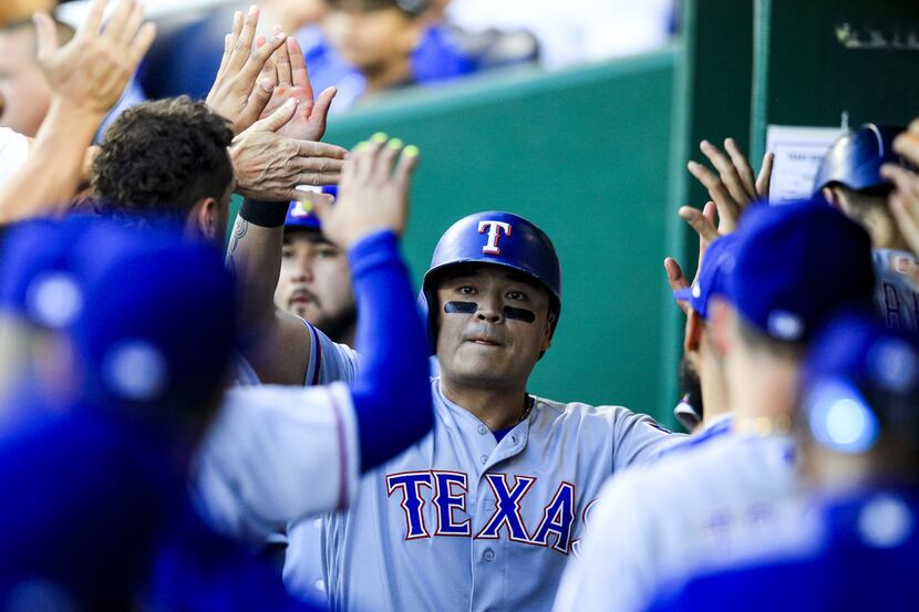 KANSAS CITY, MO - JUNE 18: Shin-Soo Choo #17 of the Texas Rangers celebrates scoring a run...