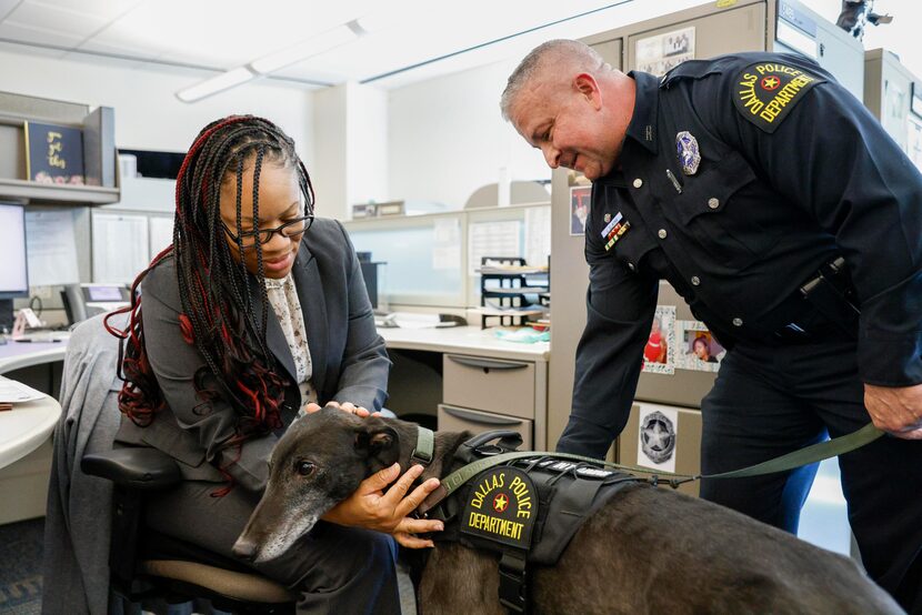 Senior Corporal Jonequia Acrond greets Aussie as Officer Joe King visits various police...