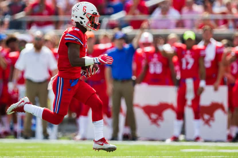 Southern Methodist Mustangs running back Braeden West (6) runs the ball during the first...