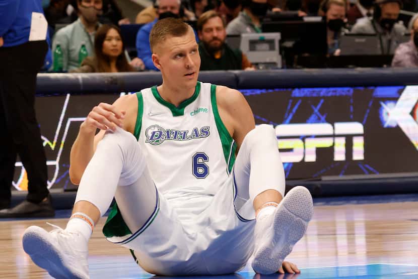 Dallas Mavericks center Kristaps Porzingis (6) gathers himself before getting up in a game...