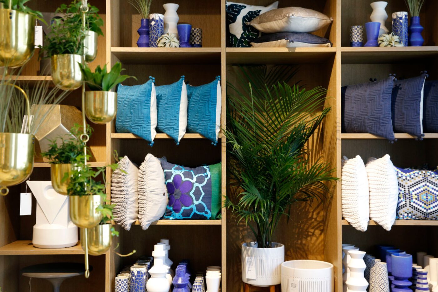 A selection of pillows and planters at West Elm in Plano.