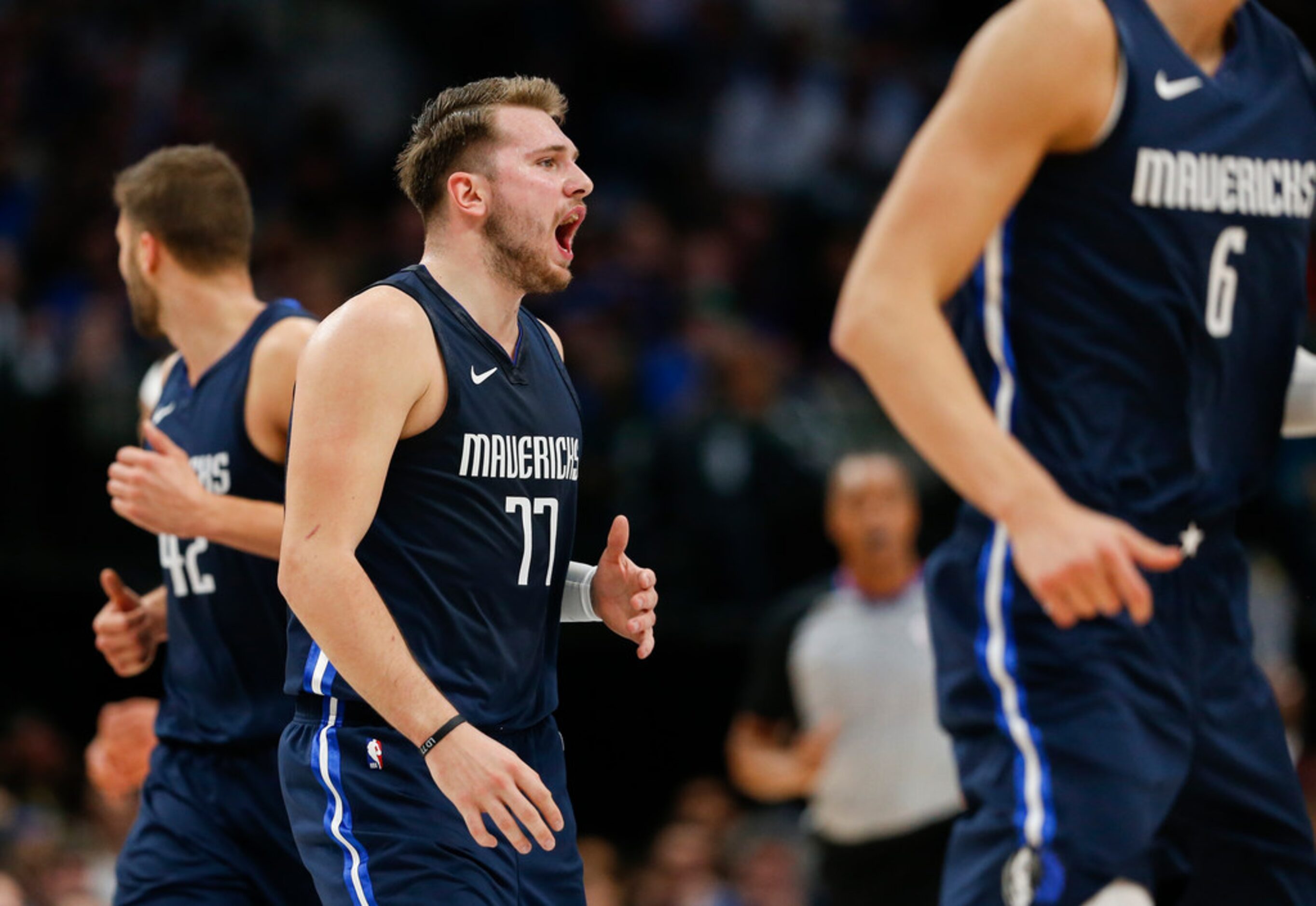 Dallas Mavericks guard Luka Doncic (77) celebrates a play during the third quarter of an NBA...