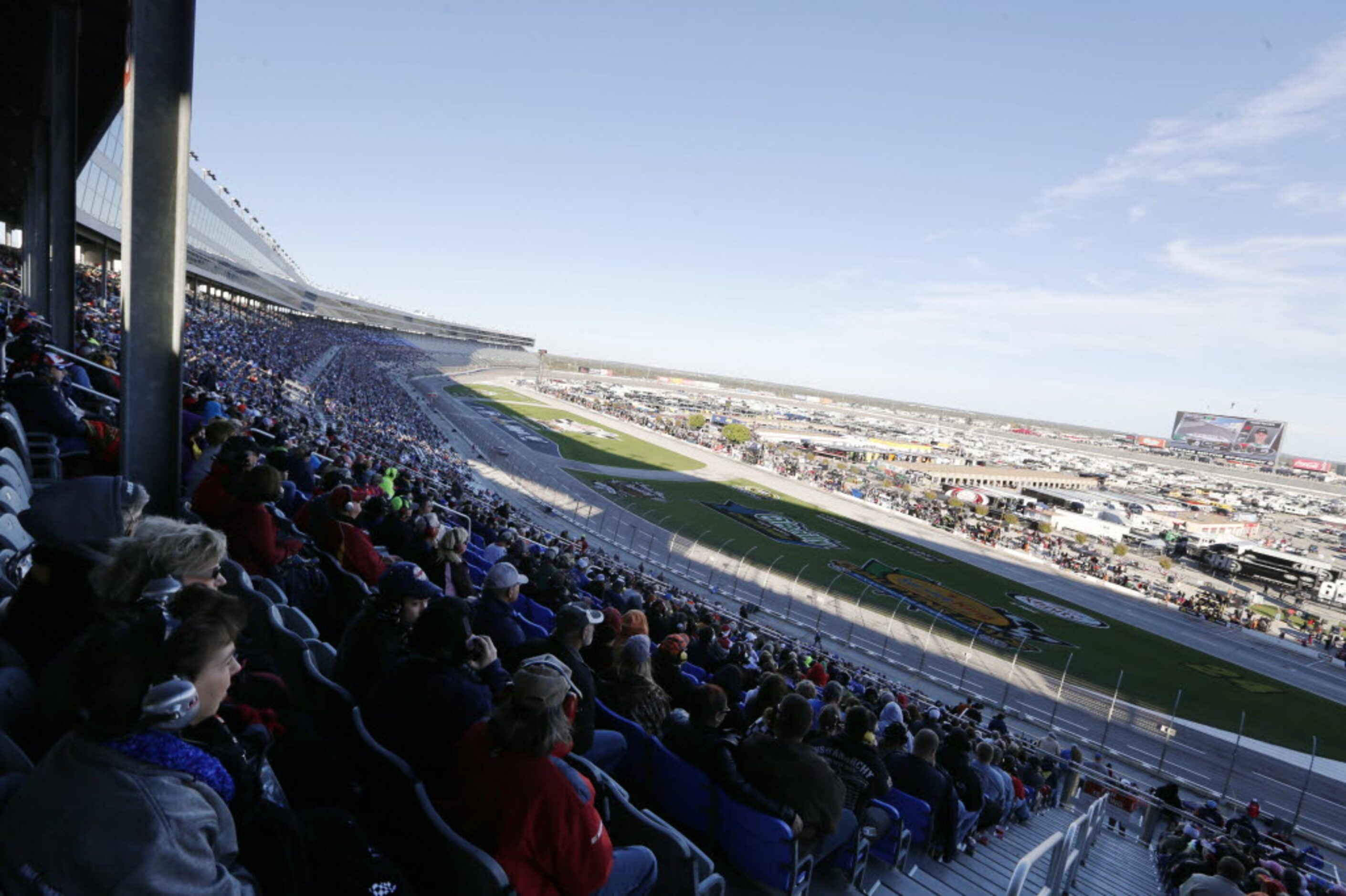 Fans watch as race cars go by during the NASCAR XFINITY SERIES 11th Annual O'Reilly Auto...