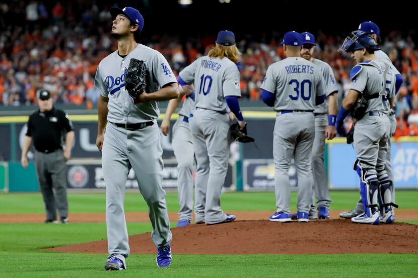 Los Angeles Dodgers starting pitcher Yu Darvish, of Japan, leaves the game against the...