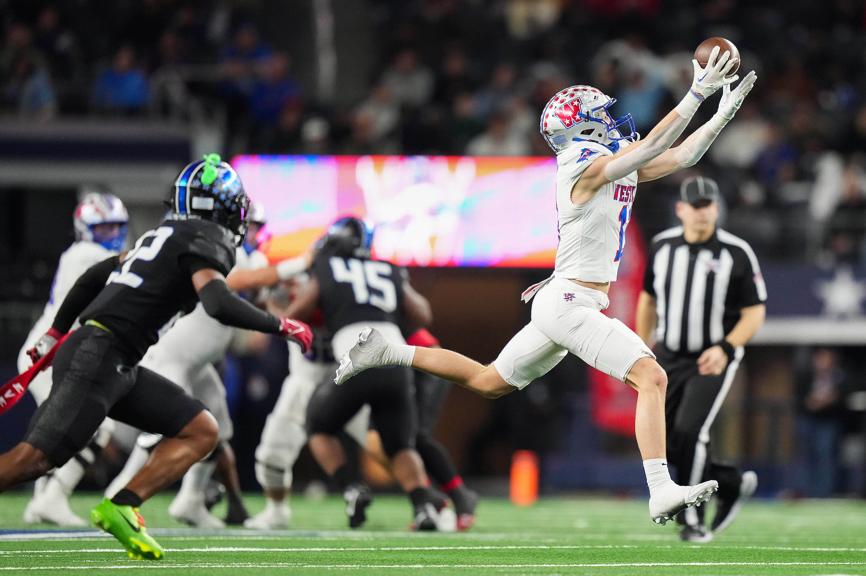 Austin Westlake wide receiver Chase Bowen (11) hauls in a 28 yard pass as North Crowley...