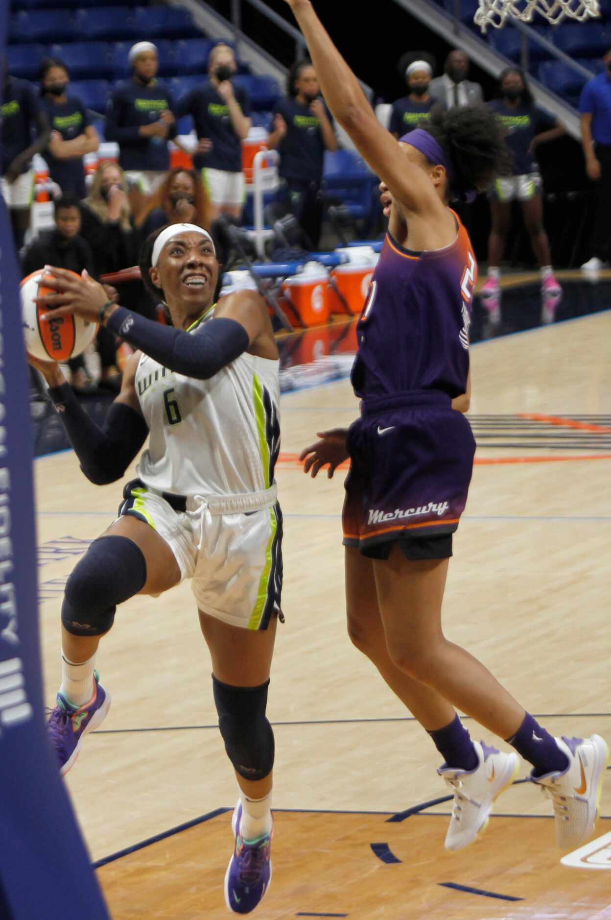Dallas Wings forward Kayla Thornton (6) drives to the basket past the defense of Phoenix...
