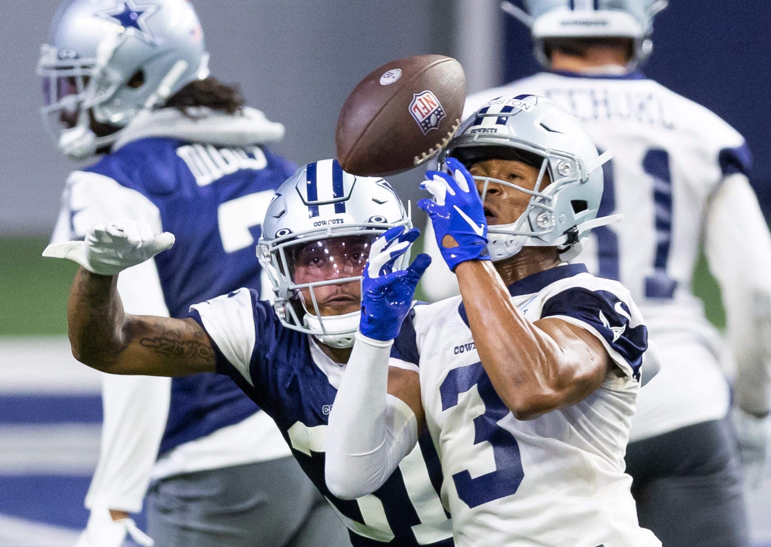 Photos: So close! Cowboys receiver Dennis Houston attempt to catch a pass  while defended by Tyler Cole