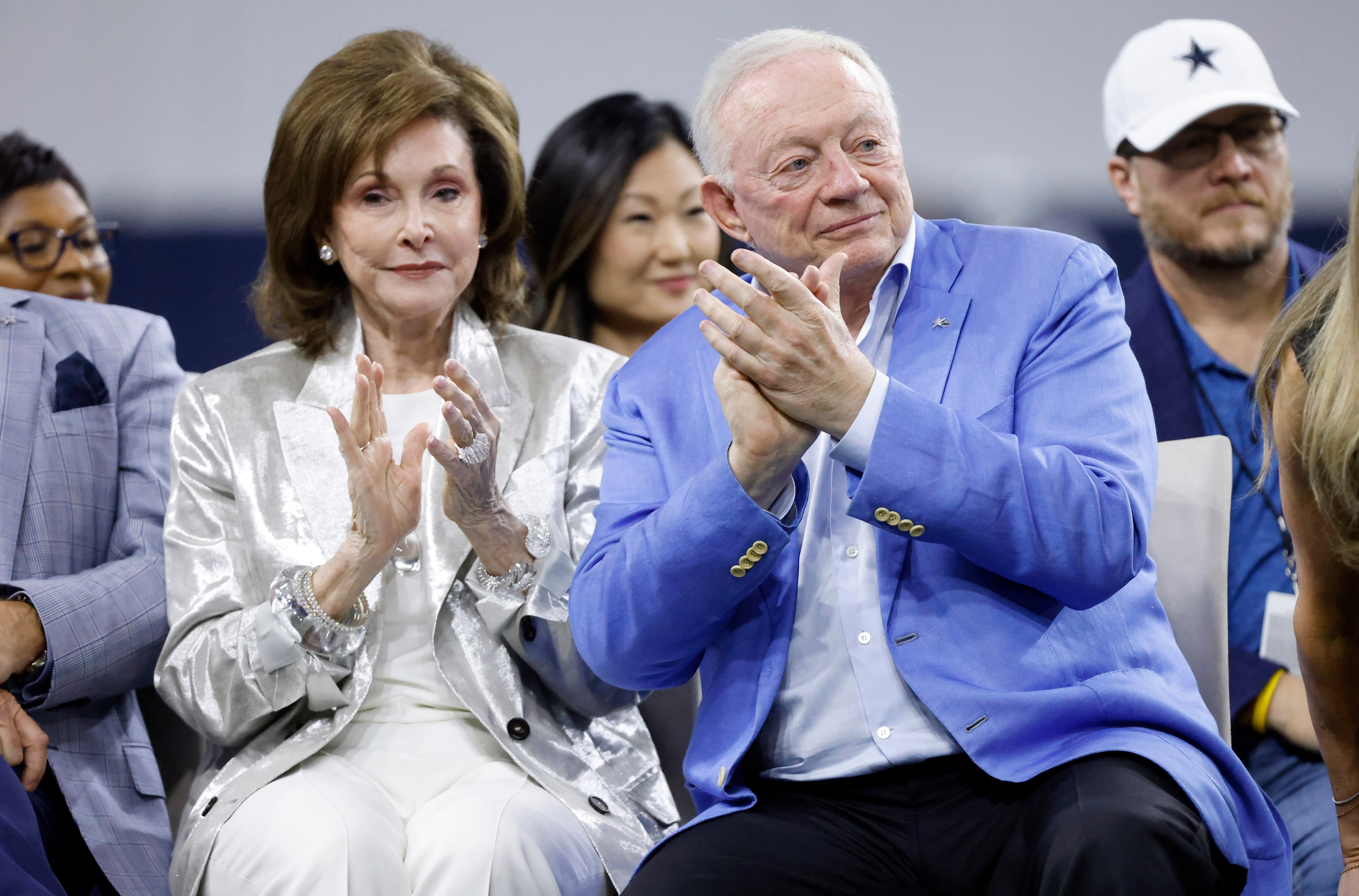 Dallas Cowboys owner Jerry Jones and his wife Gene applaud during the Season Kickoff...