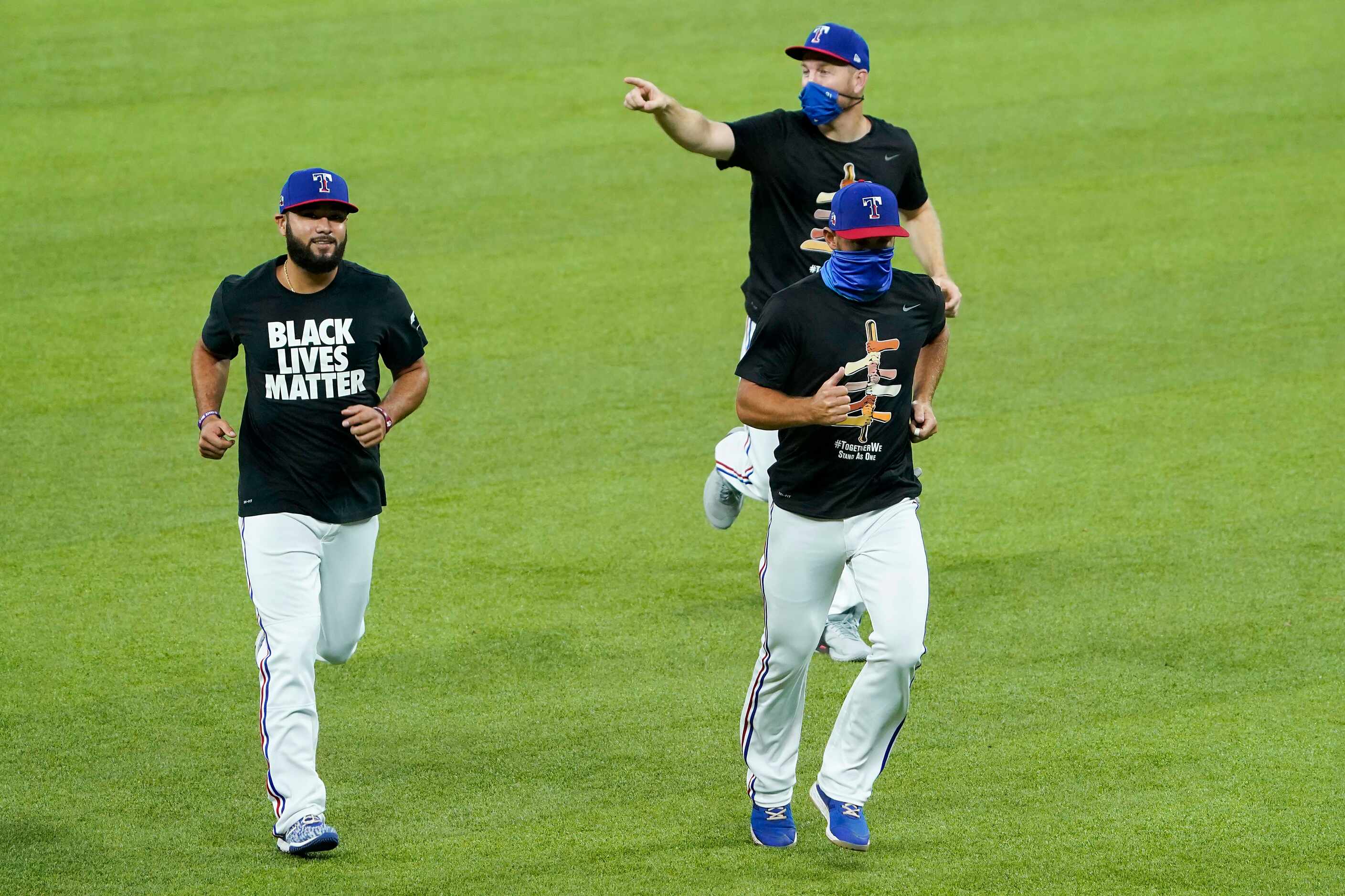 Infielder Isiah Kiner-Falefa (left) catcher Jeff Mathis, and infielder Todd Frazier (top...