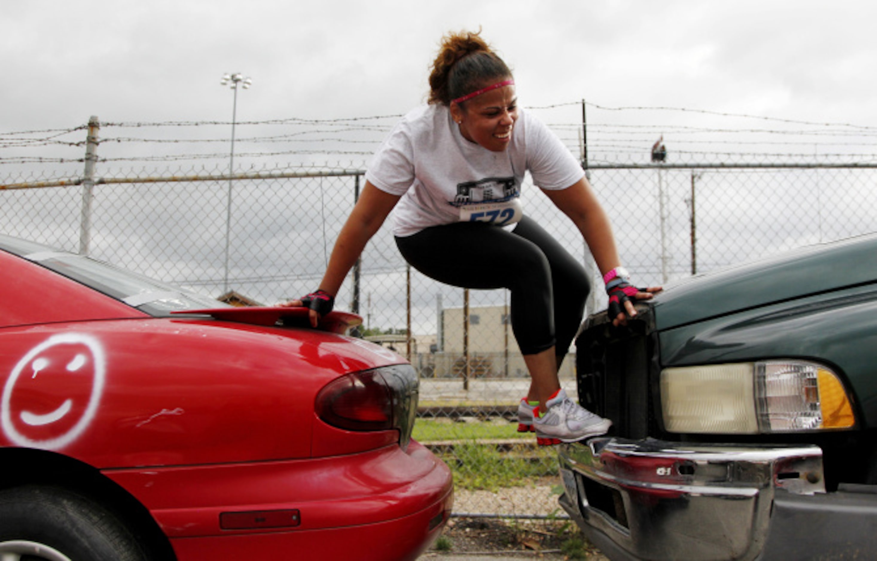 Sabrina Price works her way from one car to another during the Second Annual Fair Park 5K...