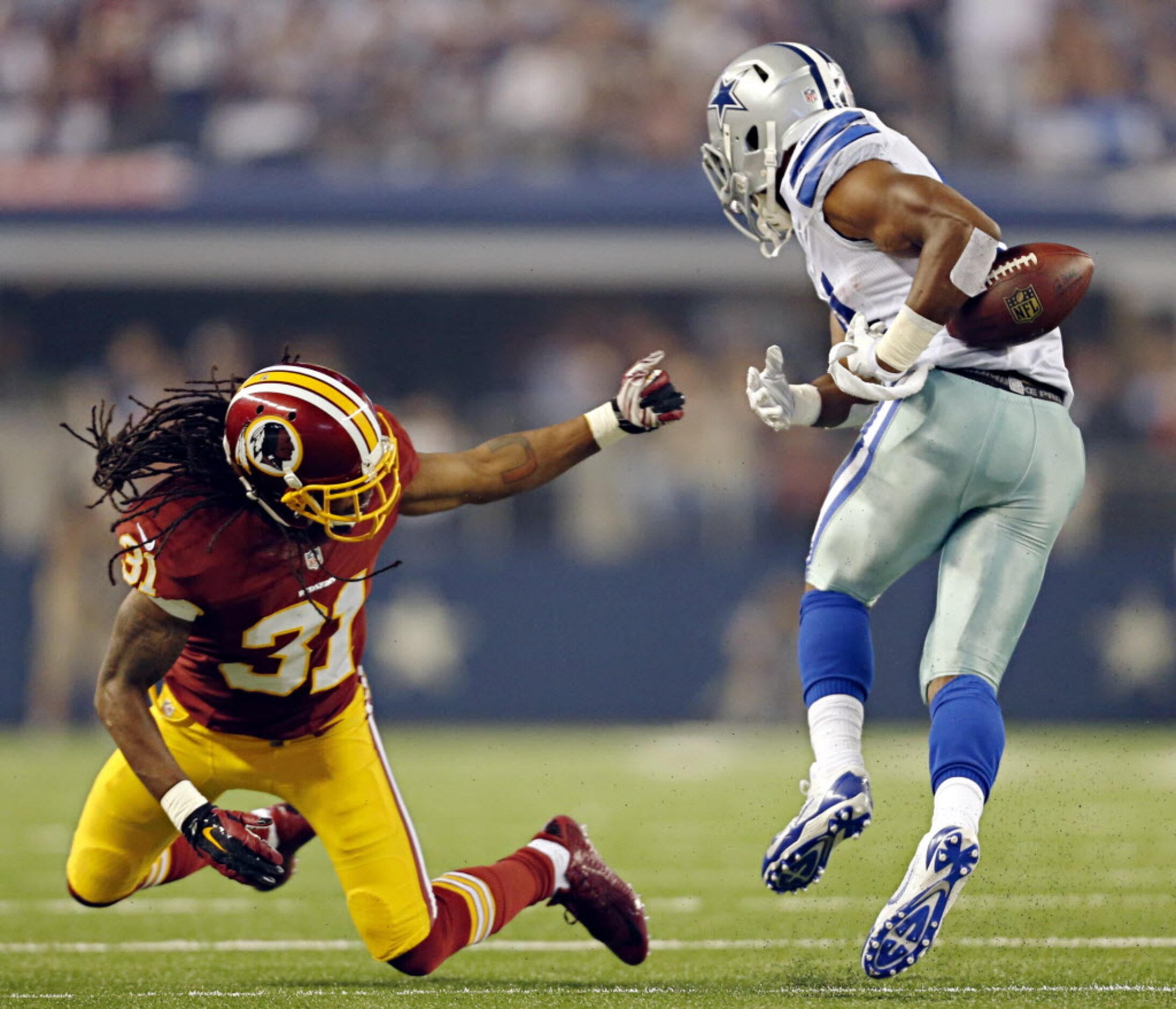 Washington Redskins strong safety Brandon Meriweather (31) knocks the ball from Dallas...