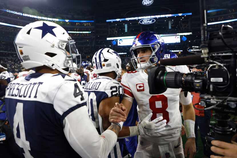 Dallas Cowboys quarterback Dak Prescott (4) shakes hands with New York Giants quarterback...