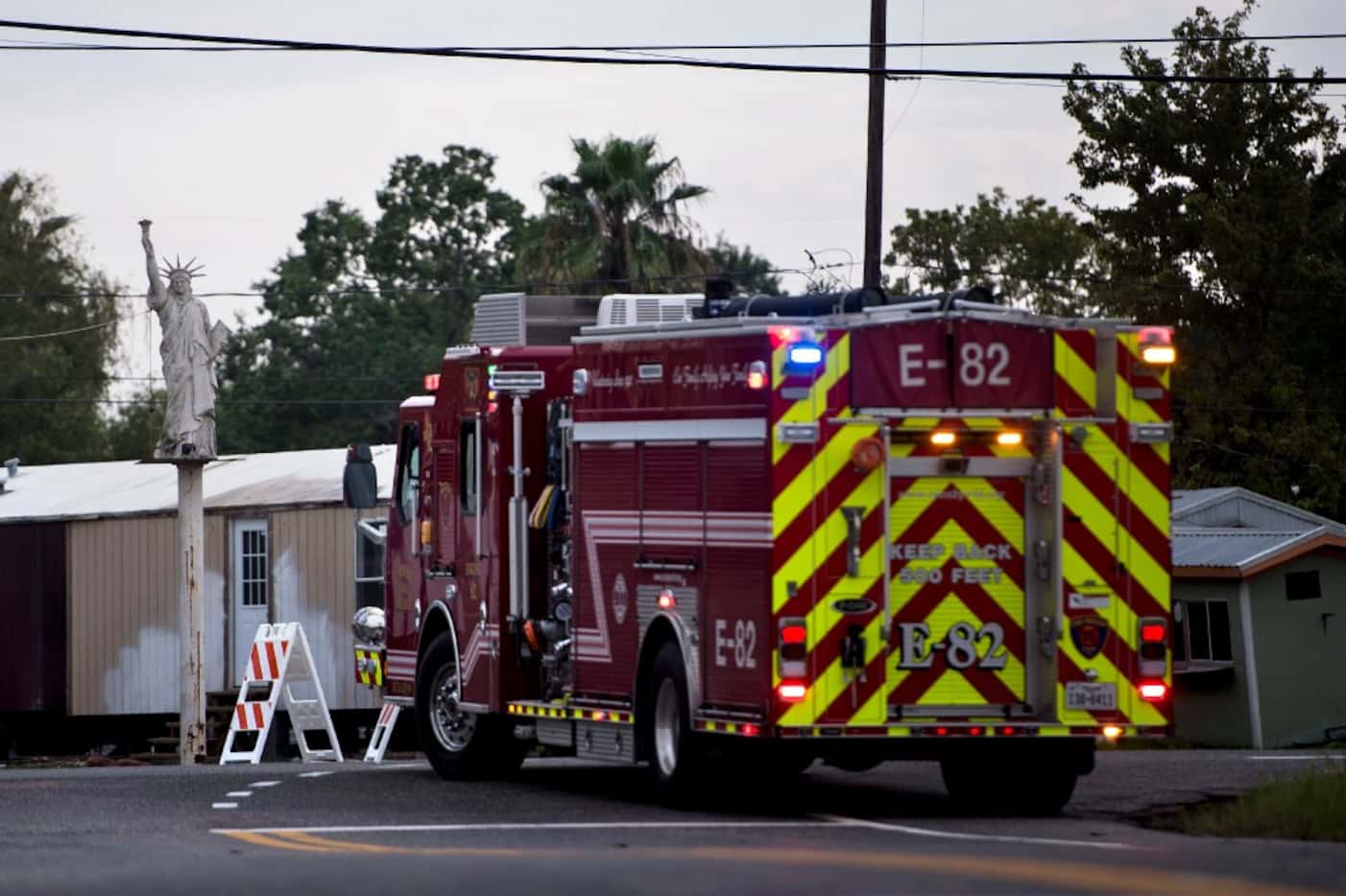 A firetruck waits at a roadblock after a chemical plant operated by the Arkema Group had an...
