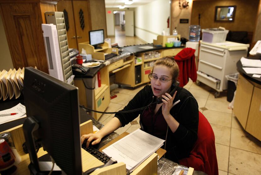 Cheyanne Hooper answered calls at the shelter’s information center on Tuesday. Two lots...