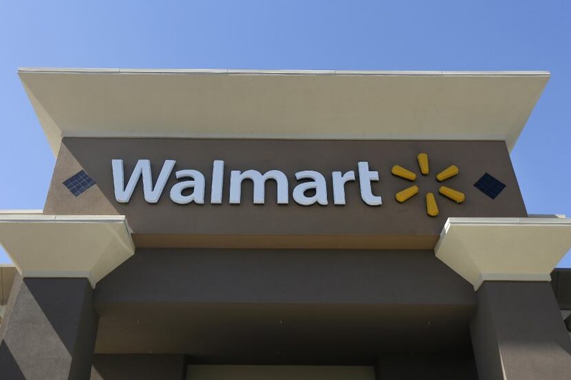 FILE - This Sept. 19, 2013, file photo, shows the sign of a Wal-Mart store in San Jose,...