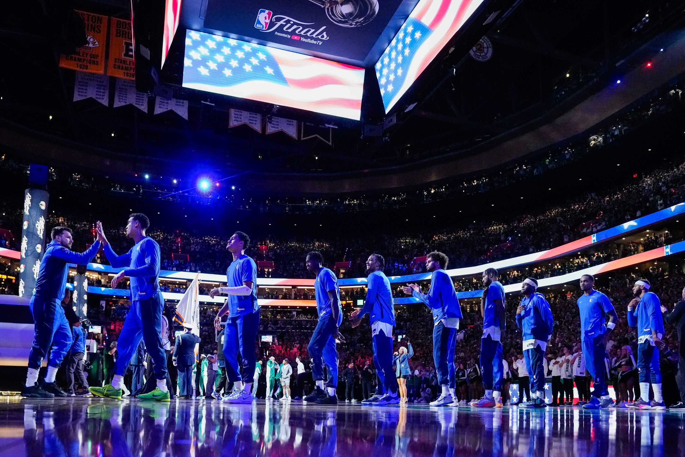 Dallas Mavericks players high five before  Game 5 of the NBA Finals against the Boston...