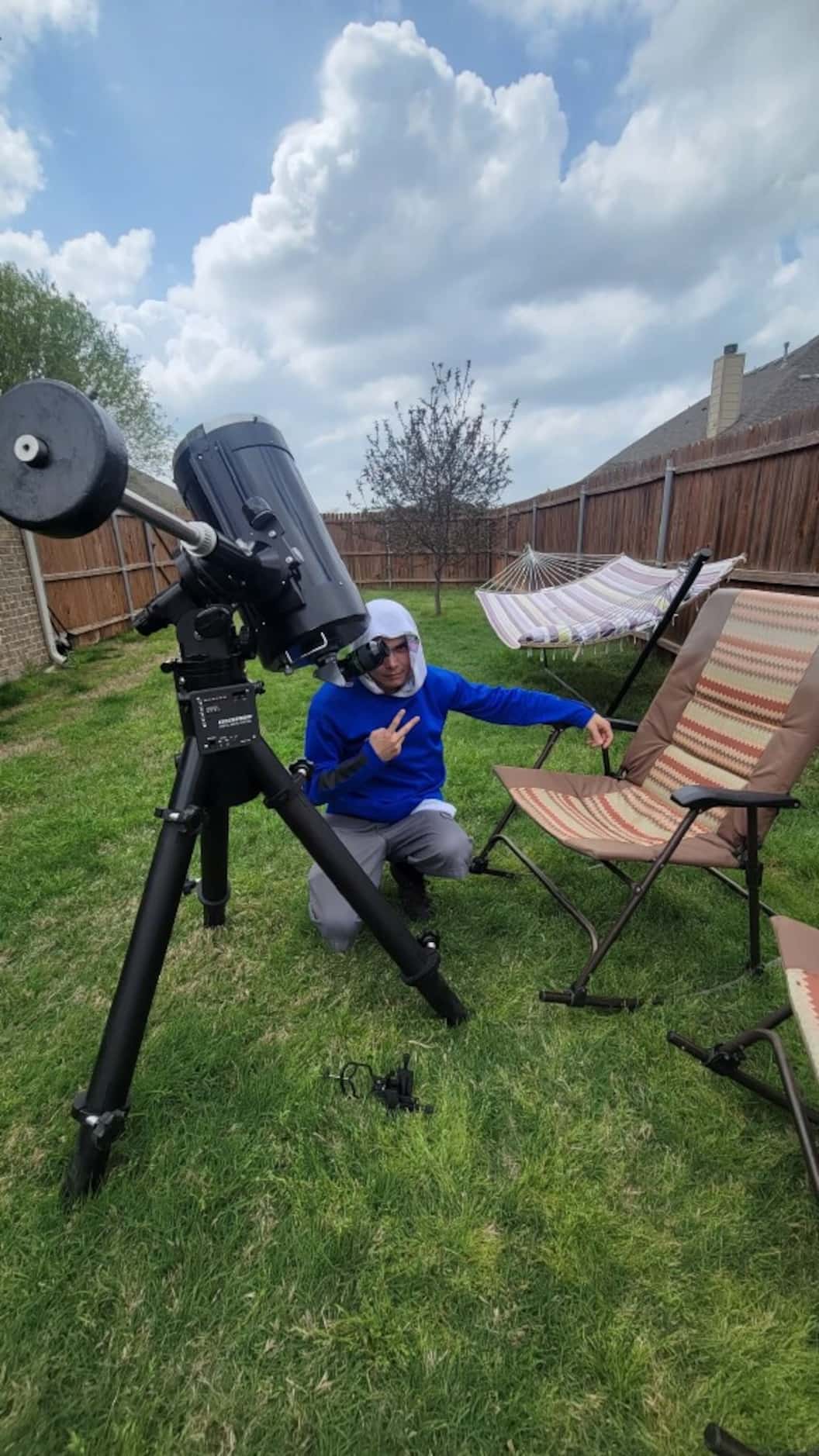Kenneth Hafer poses with his 90s-era Celestron C-11 telecsope to view the eclipse in...
