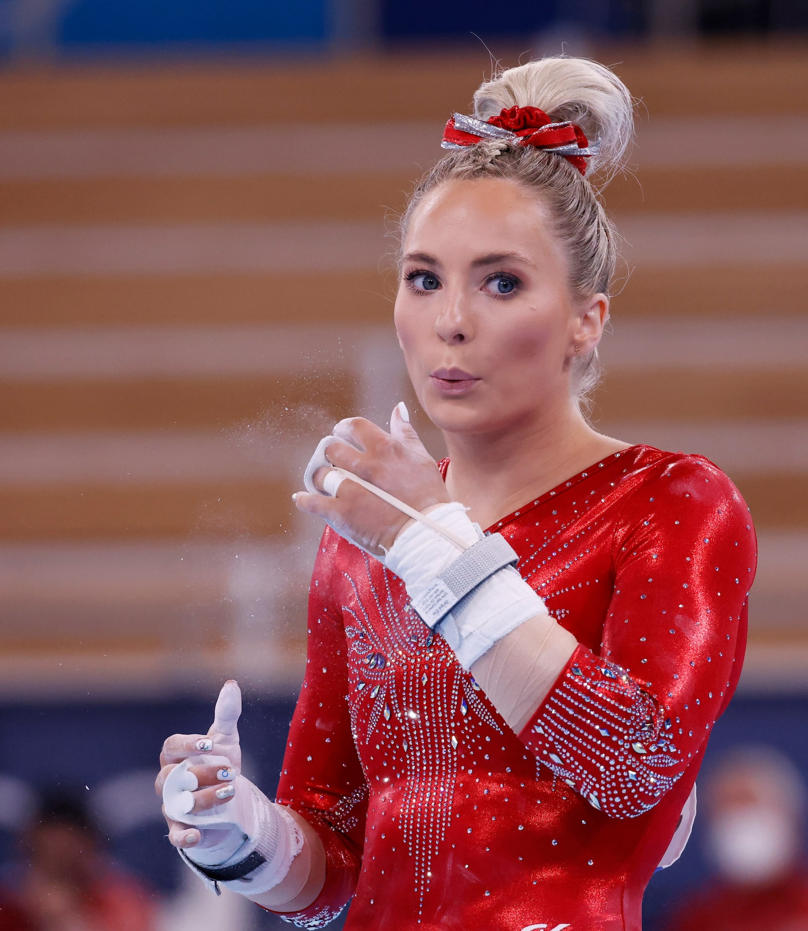 USA’s MyKayla Skinner blows excess chalk off her hands in a women’s gymnastics event during...