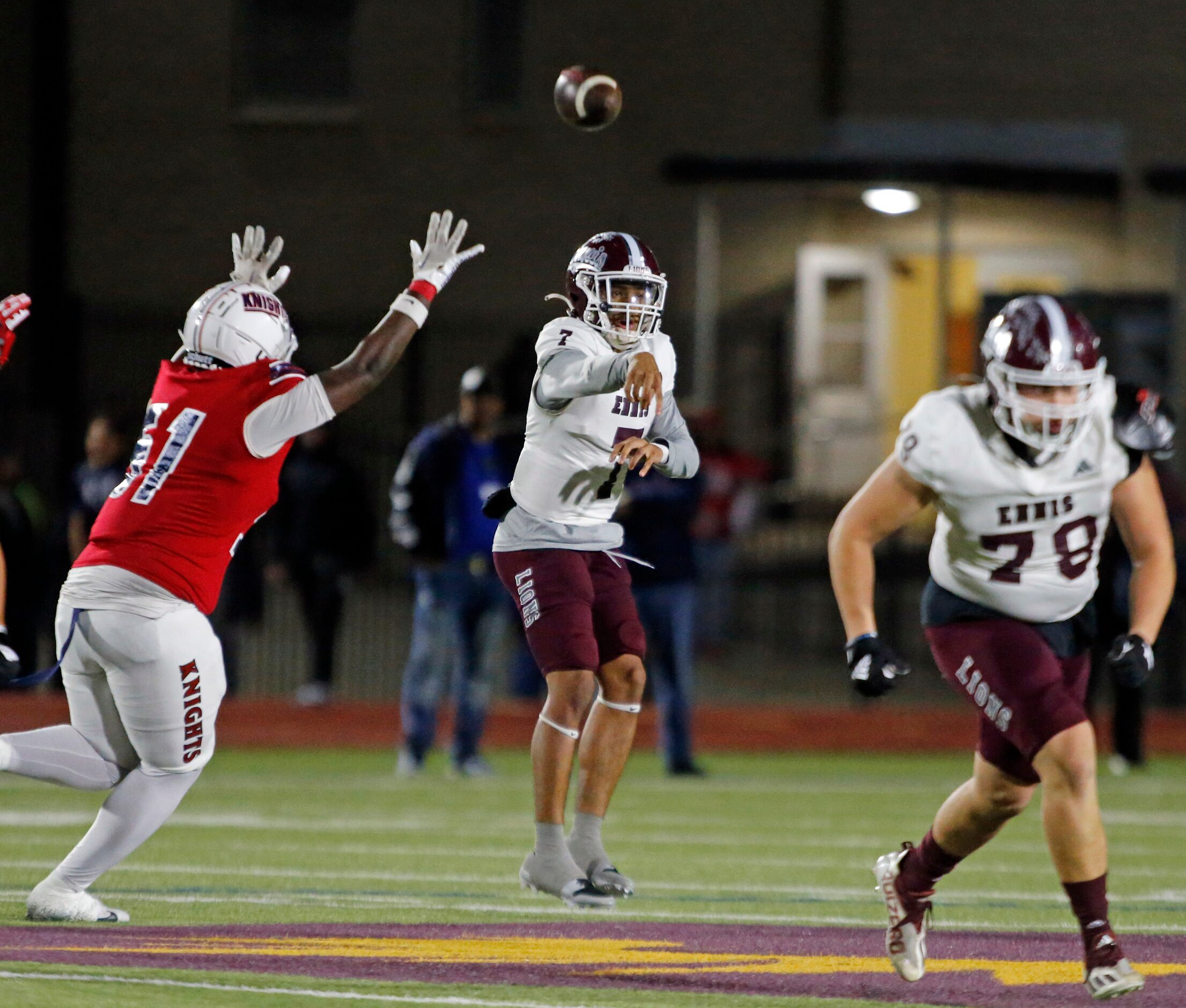 Ennis high  QB Wondame Davis Jr. (7) throws a pass during the first half of a high school...