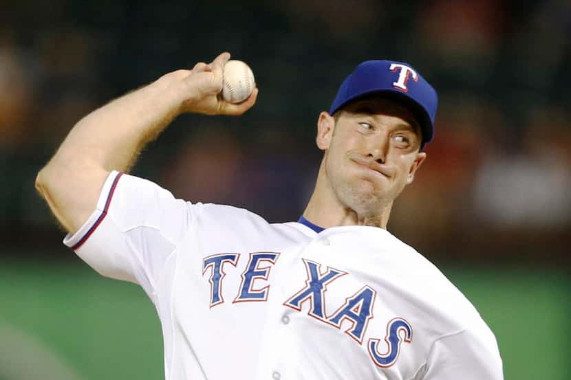 Texas Rangers relief pitcher Ross Ohlendorf (25) pitches in a game against the Chicago White...