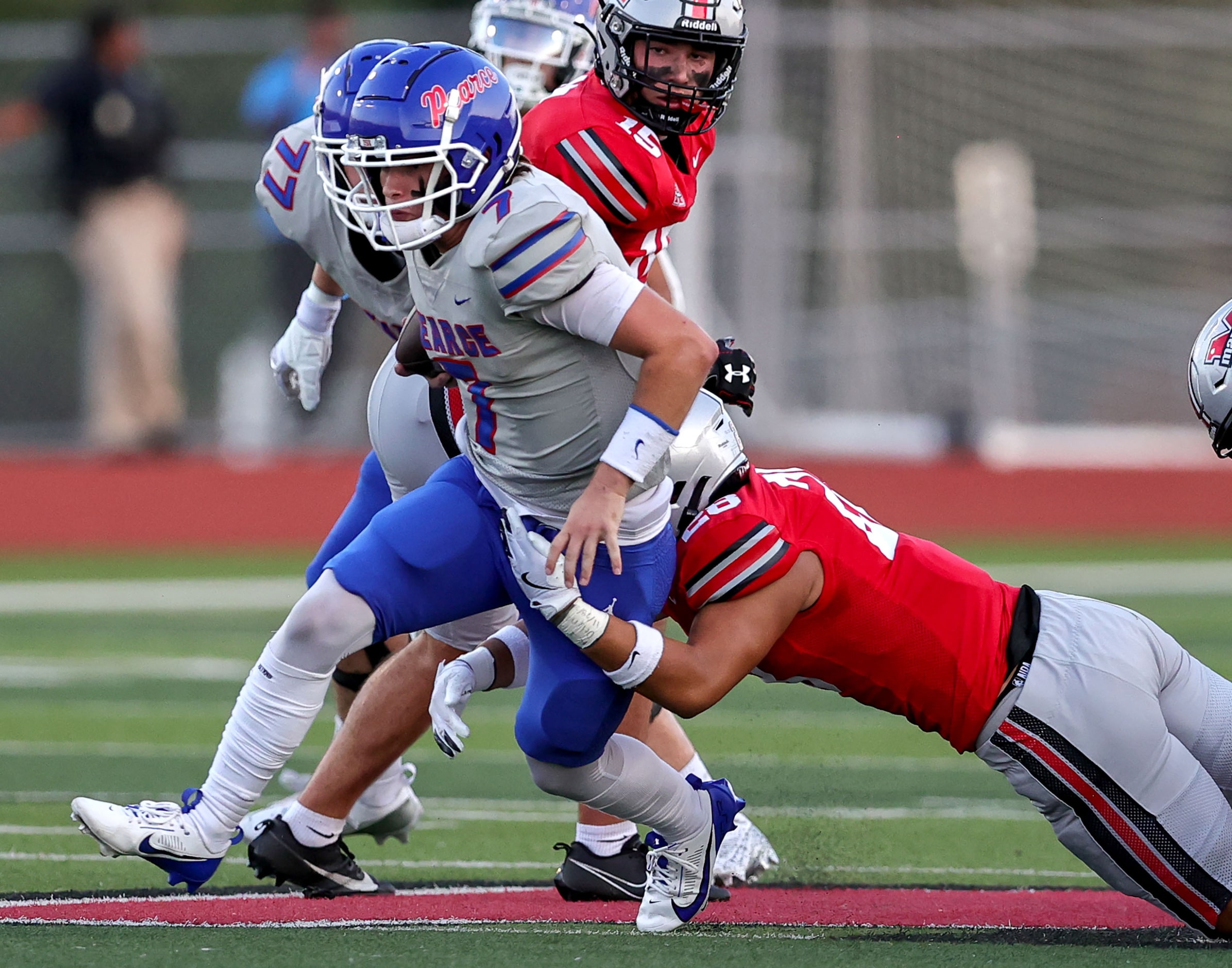 Richardson Pearce quarterback Presley Harper (7) makes a nice run as he is brought down by...