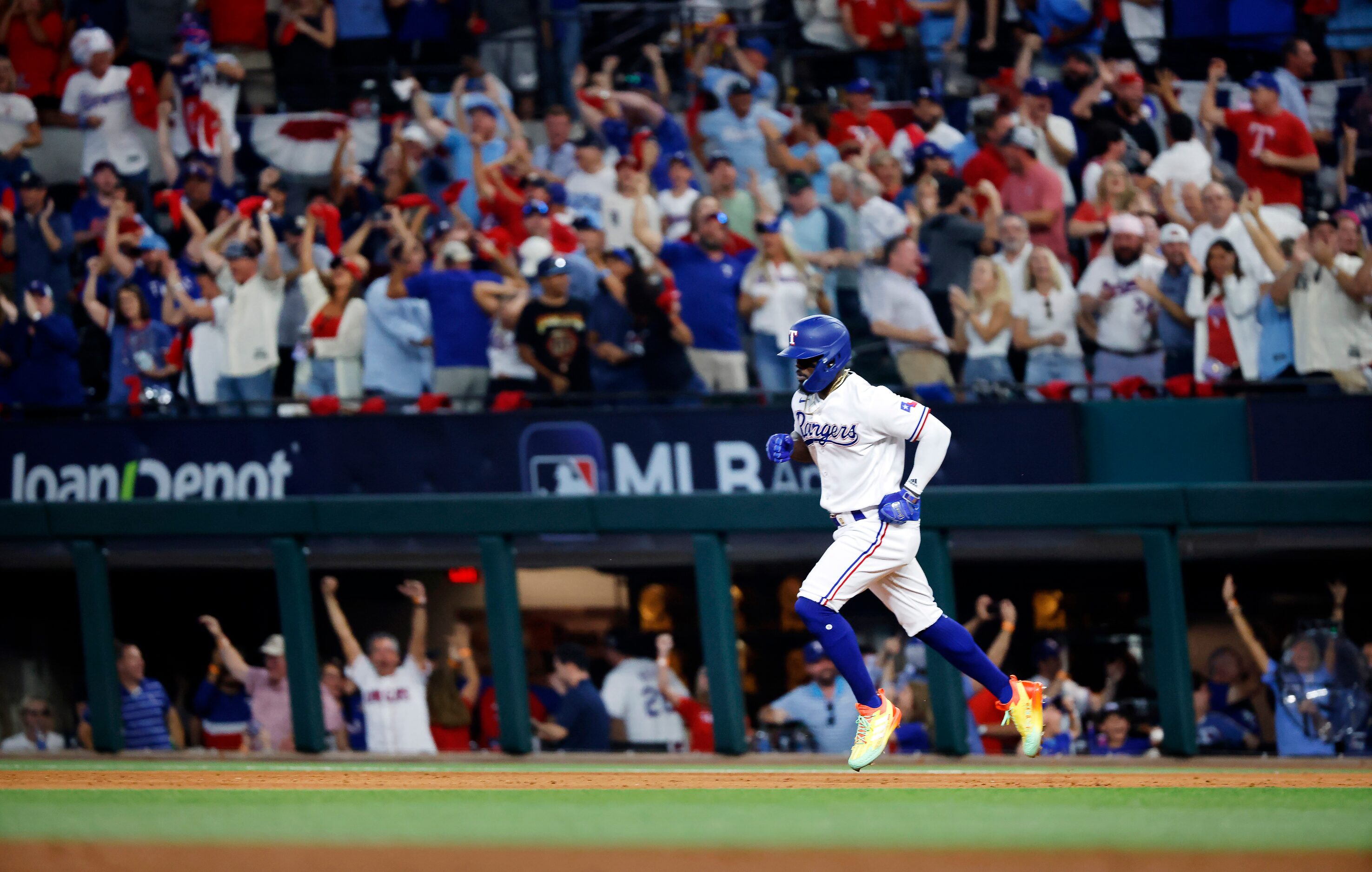 Texas Rangers batter Adolis Garcia (53) rounds the bases after hitting a three-run homer off...