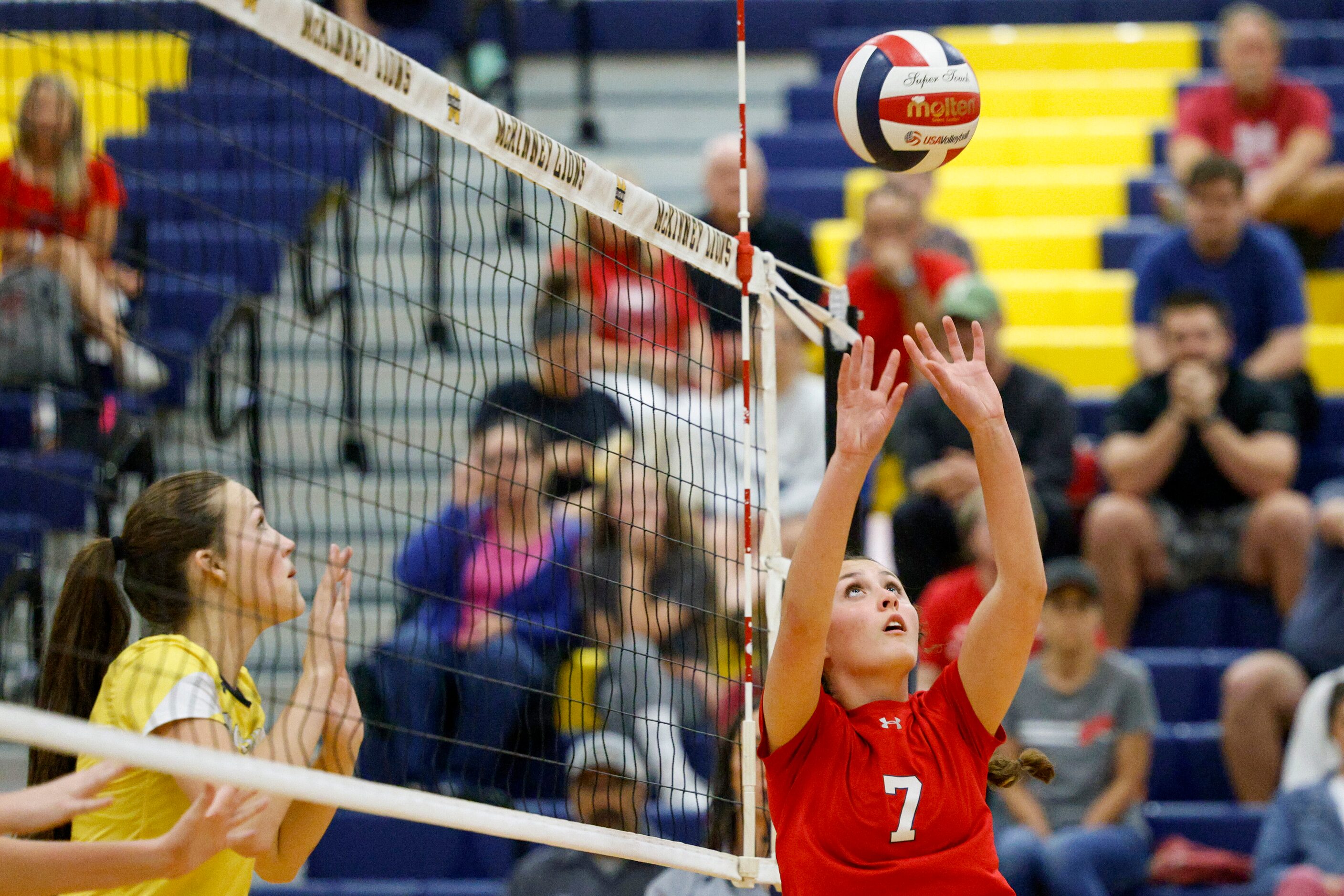 McKinney Boyd’s Sara Quigley (7) sets the ball for a teammate during a volleyball match...