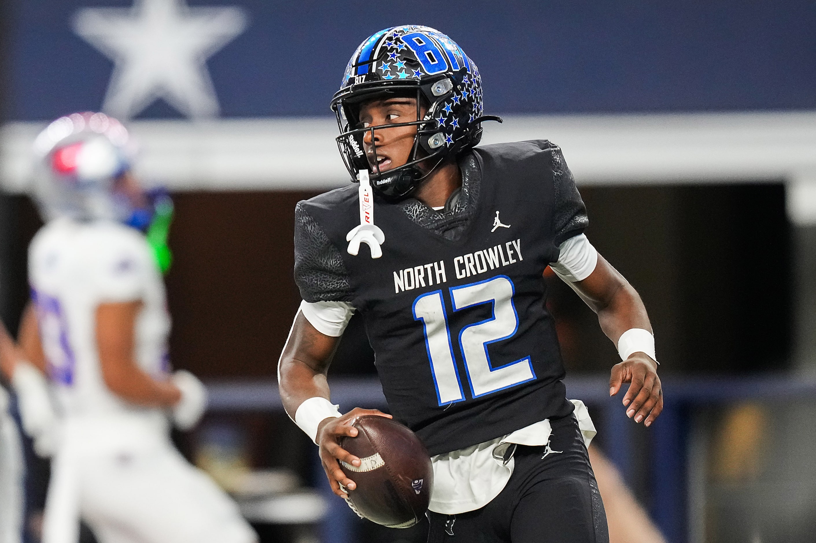 North Crowley quarterback Chris Jimerson (12) celebrates after scoring on a 44-yard...