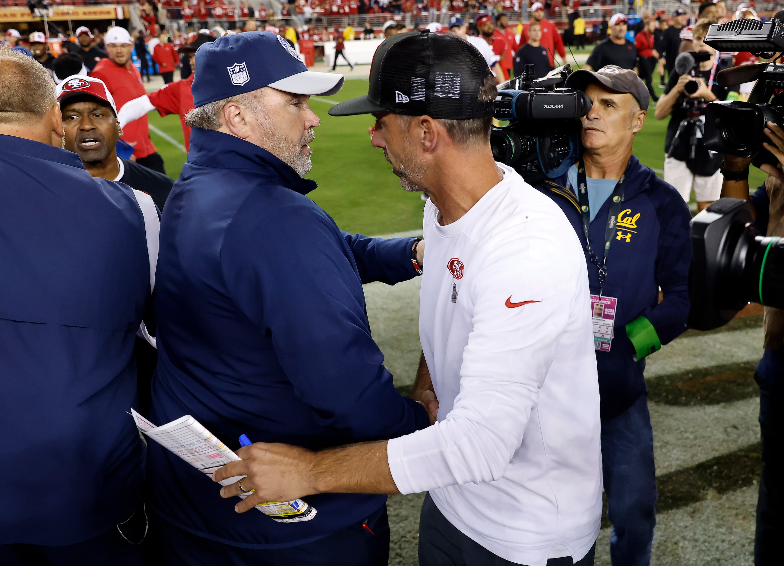 Dallas Cowboys head coach Mike McCarthy and San Francisco 49ers head coach Kyle Shanahan...