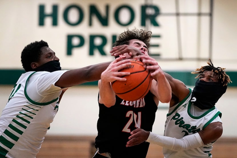 Mesquite Poteet forward Tavarius Hamilton (left) and guard Jeremiah Lynch (2) wear face...