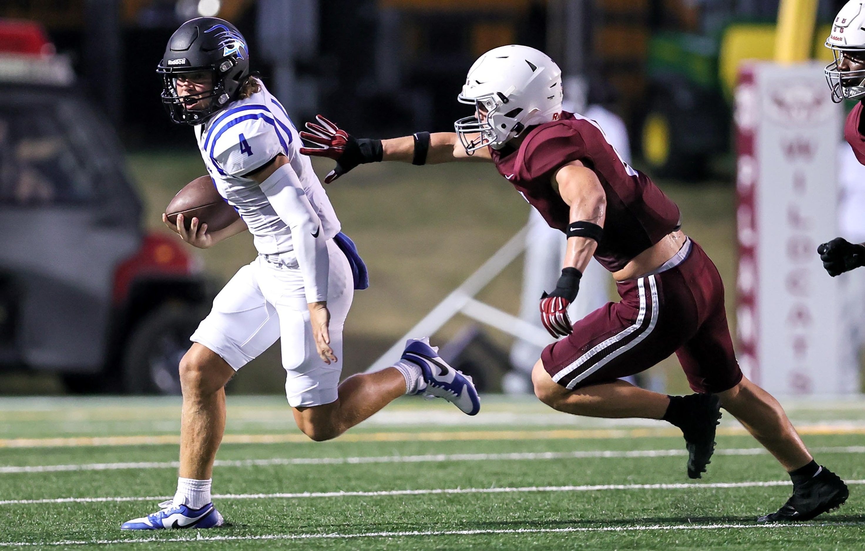 Byron Nelson quarterback Nicholas Blevins (4) tried to avoid getting sacked by Plano...