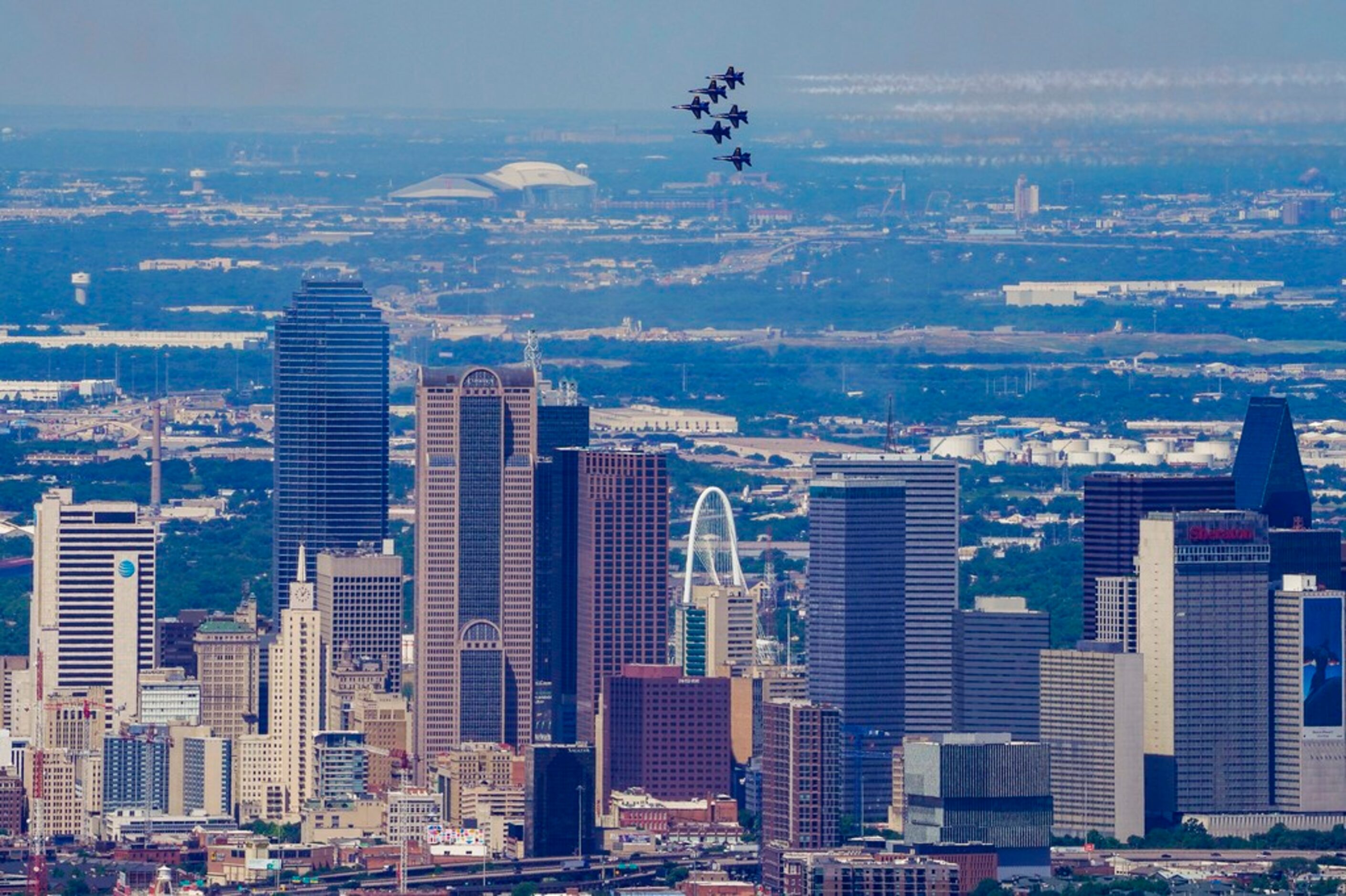 The U.S. Navy Blue Angels fly over the downtown Dallas skyline on Wednesday, May 6, 2020. ...