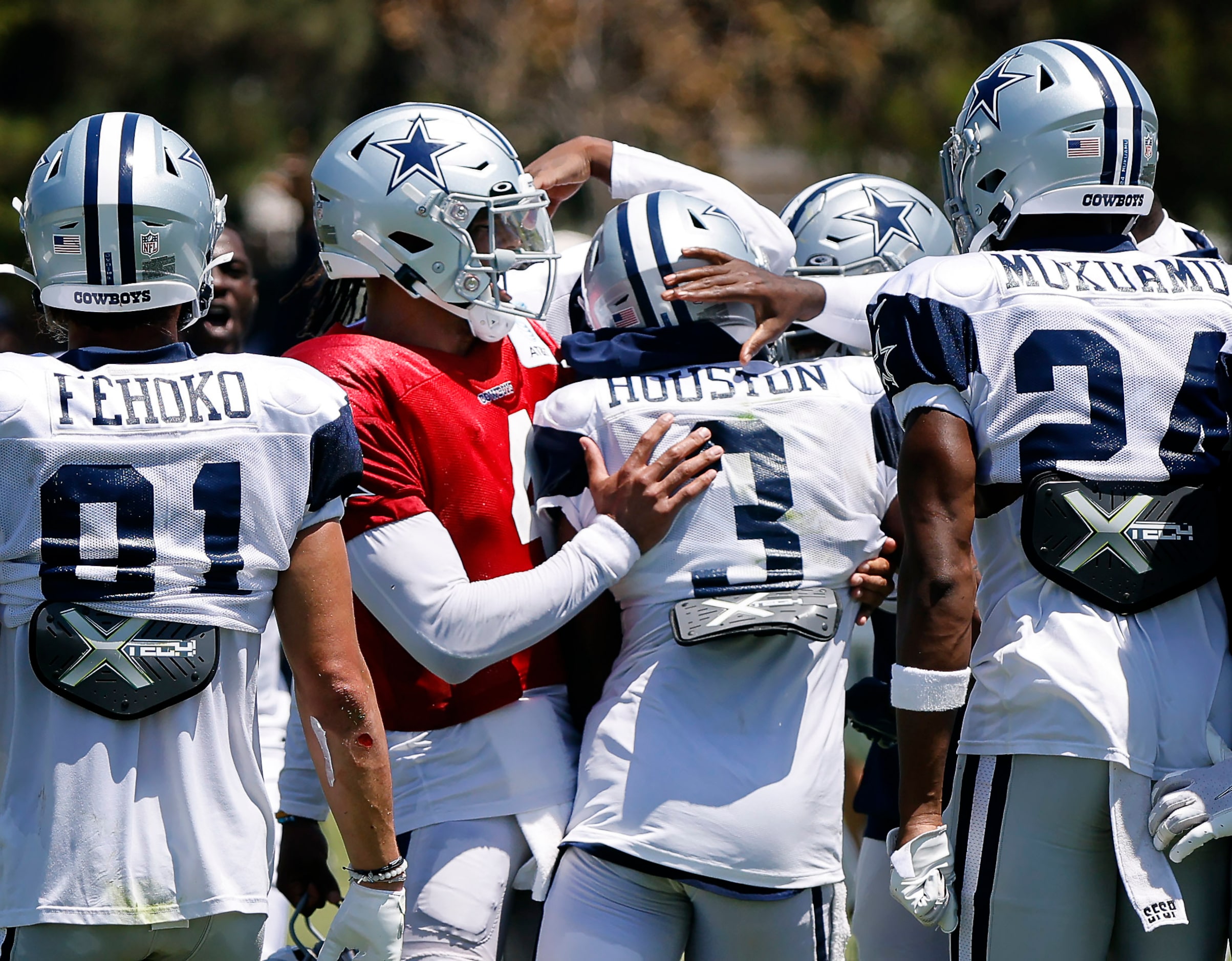 Dallas Cowboys quarterback Dak Prescott (4) congratulates wide receiver Dennis Houston (3)...