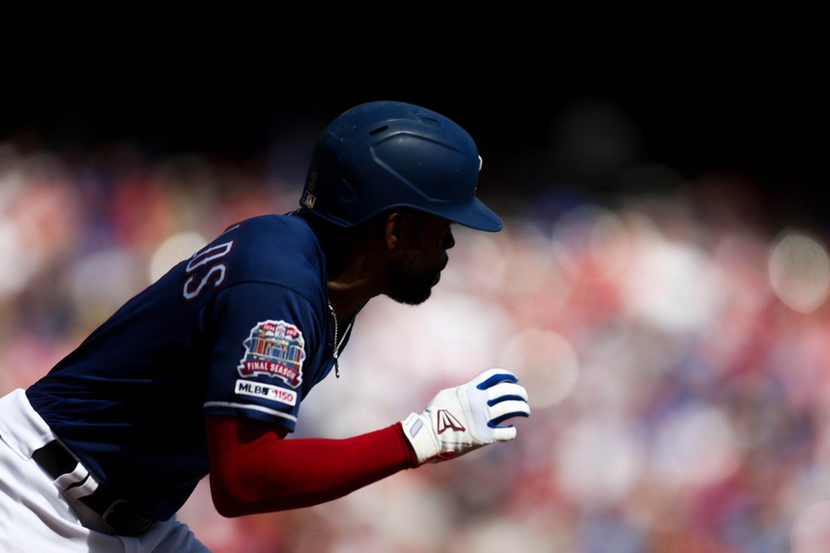 Texas Rangers center fielder Delino DeShields (3) runs to first during a MLB game between...