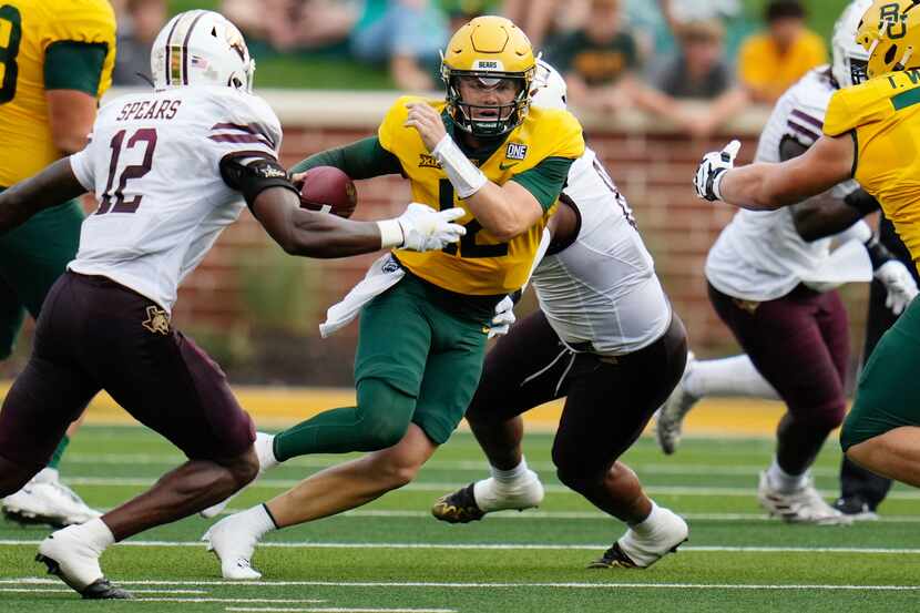Baylor quarterback Blake Shapen escapes the pocket against Texas State safety Tory Spears in...