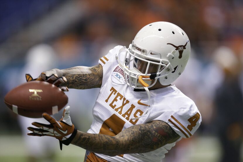 Texas' Kenny Vaccaro (4) before the team's Alamo Bowl NCAA football game against Oregon...