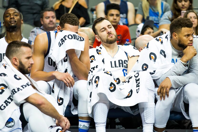 Dallas Mavericks forward Harrison Barnes (left), guard J.J. Barea (bottom left), forward...