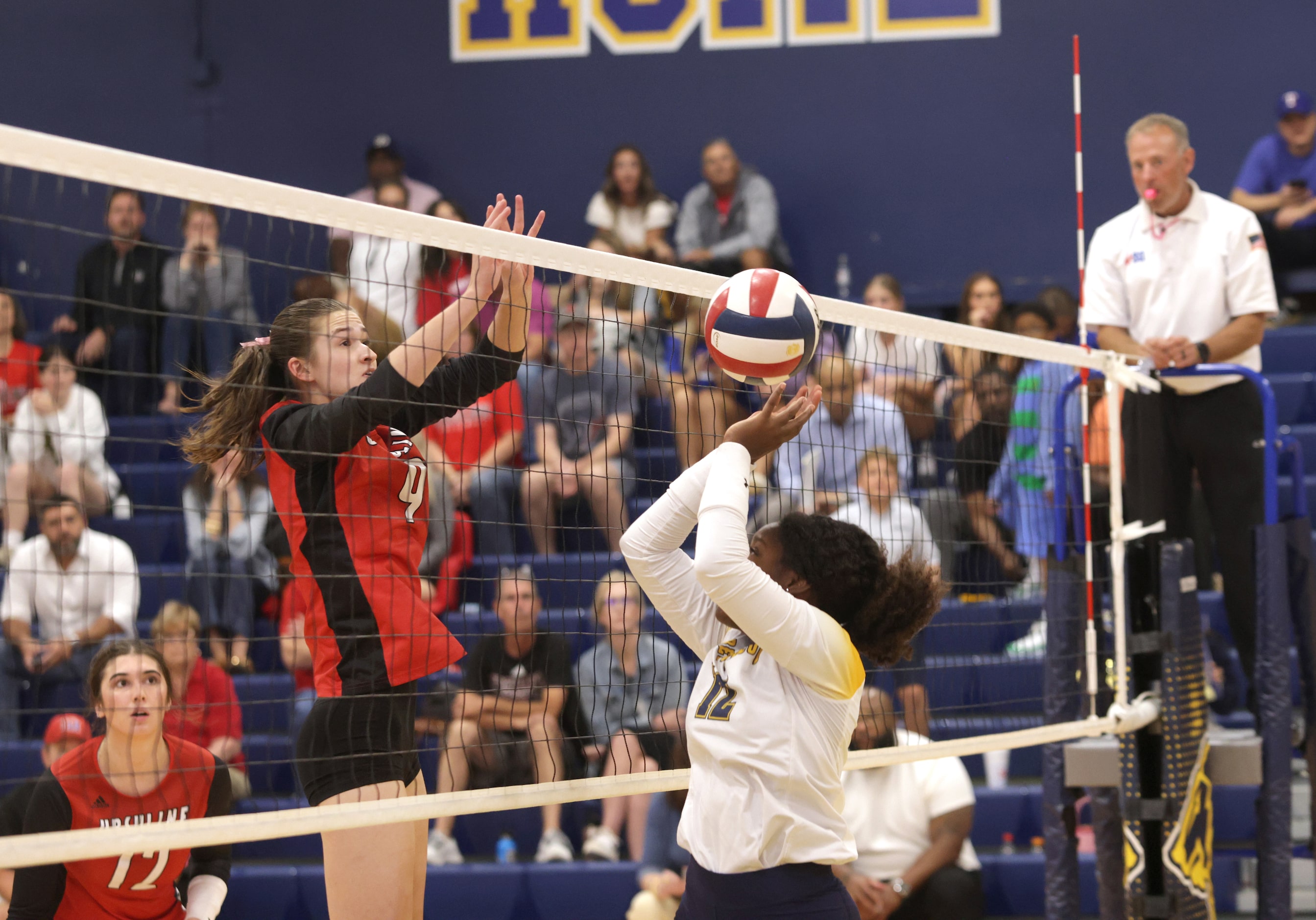 Ursuline player #9 Mckenzie Murray gets the ball past Prestonwood player #12 Taylor X during...