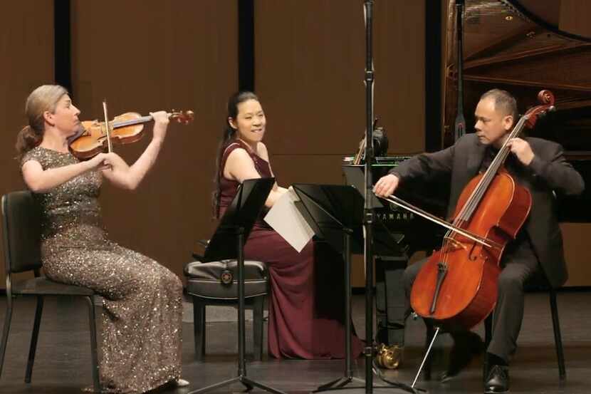 Violinist Amy Schwartz Moretti, pianist Joyce Yang and cellist Bion Tsang perform in a...