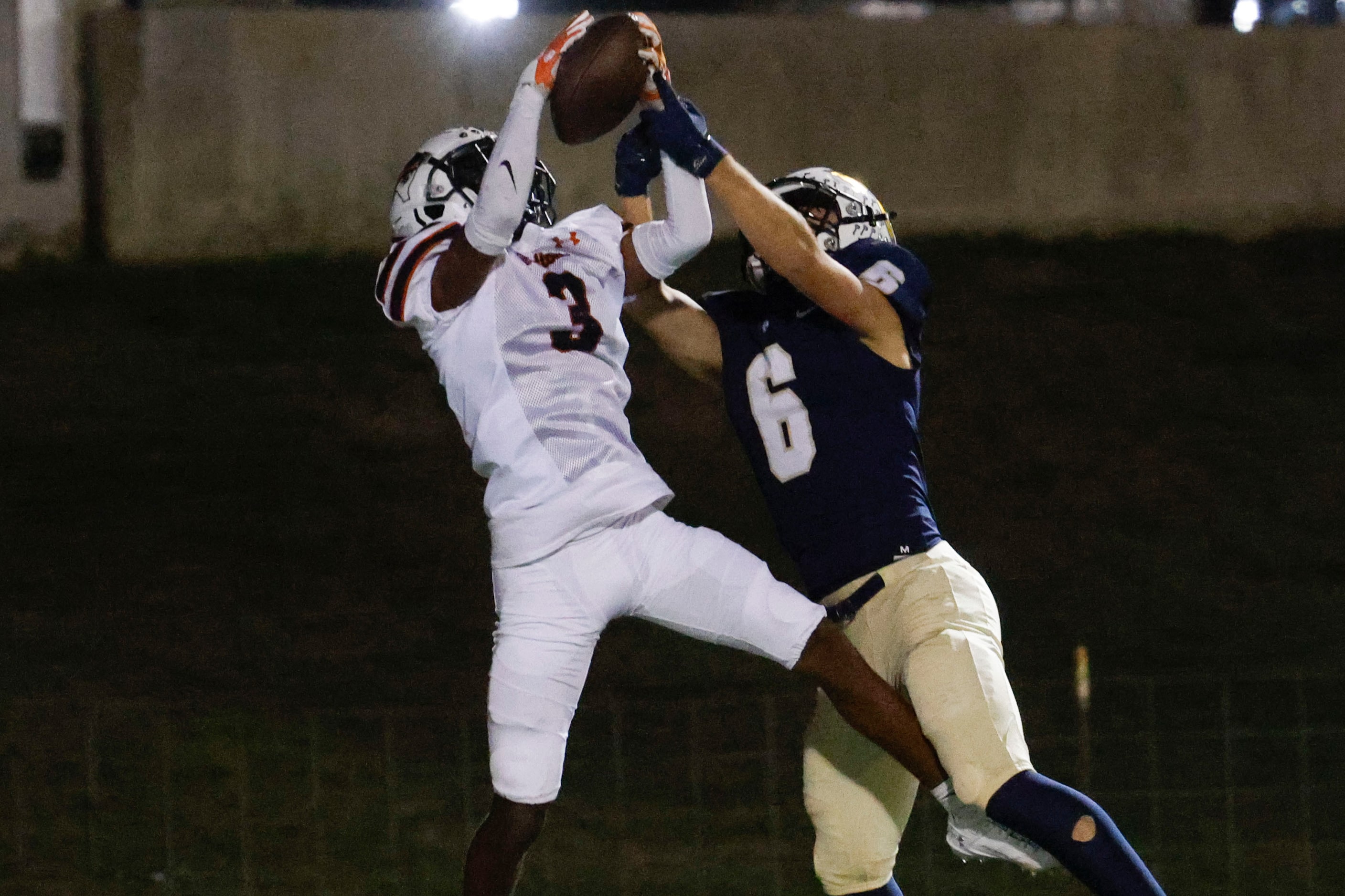 Haltom high’s Darius Harkless (left) intercepts a touchdown pass intended for Keller High’s...