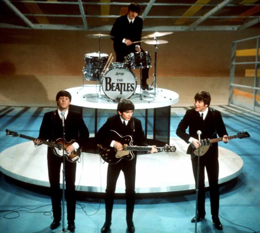 In this Feb. 9, 1964 file photo, The Beatles perform on CBS' "Ed Sullivan Show" in New York....