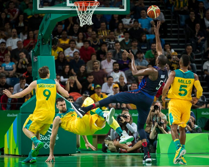 Andrew Bogut (6) of Australia is knocked to the floor as Kevin Durant (5) of the United...