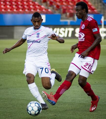 #21 Bicou Bissainthe of North Texas SC passes the ball against Forwrd Madison in USL League...