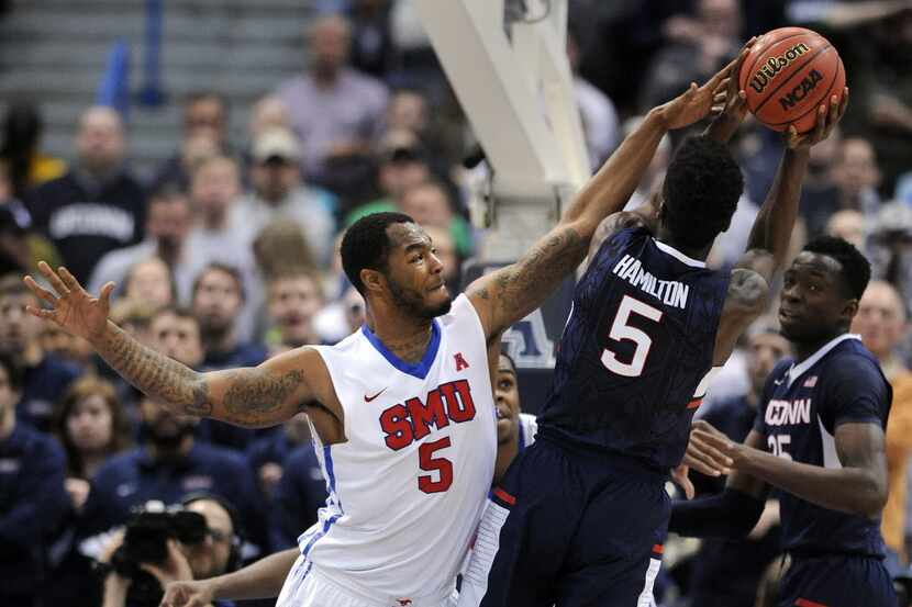 FILE - SMU's Markus Kennedy (5) defends UConn's Daniel Hamilton during the second half of...
